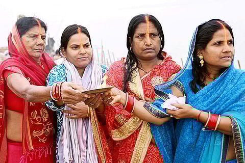 Women perform rituals on the banks of the Ganga marking the start of four-day Chaiti Chhath Puja celebrations with Nahay-Khay, in Patna.