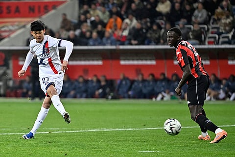 PSG's Pedro Fernandez scores his side's third goal during the French League One soccer match between Nice and Paris Saint-Germain in Nice, France.