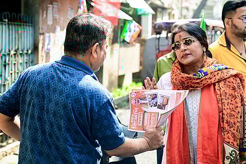 BJP candidate for Tollygunge Assembly constituency Papiya Adhikari during a door-to-door campaign for the upcoming West Bengal Assembly elections, in Kolkata.