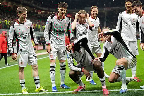 AC Milan's Youssouf Fofana, bottom center, celebrates scoring his side's 3rd goal with teammates during the Serie A soccer match between AC Milan and Torino, in Milan, Italy.