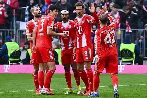 Munich's Serge Gnabry, center, celebrates after scoring his side's second goal during the German Bundesliga soccer match between FC Bayern Munich and 1. FC Union Berlin in Munich, Germany.