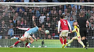 | Photo: AP/Maja Smiejkowska : Manchester City's Nico O'Reilly, heads the ball and scores the opening goal during the English League Cup final soccer match between Arsenal and Manchester City in London, Sunday, March 22, 2026.