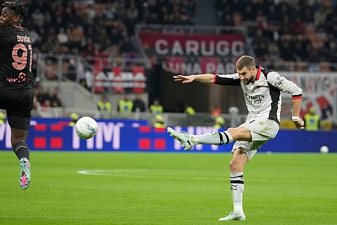 AC Milan's Strahinja Pavlovic scores his side's opening goal during the Serie A soccer match between AC Milan and Torino, in Milan, Italy.