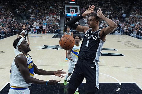San Antonio Spurs forward Victor Wembanyama (1) scores over Indiana Pacers forward Pascal Siakam (43) during the first half of an NBA basketball game in San Antonio.