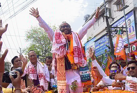 BJP candidates Pradyut Bordoloi, second left, from Dispur constituency and Diplu Ranjan, centre, from New Guwahati constituency during a rally before filing their nominations for Assam Assembly elections, in Guwahati.
