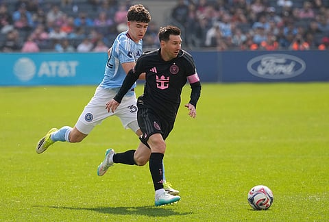 New York City FC's Jonathan Shore, left, chases Inter Miami's Lionel Messi during the second half of an MLS soccer game at Yankee Stadium in New York.