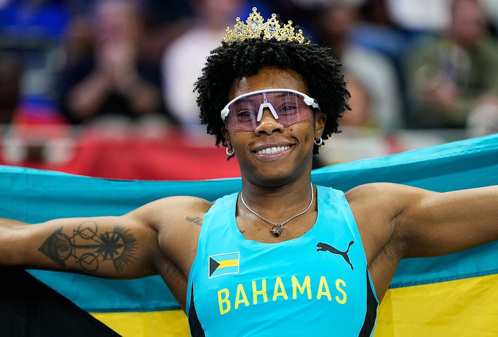 Devynne Charlton, of Bahamas, poses after winning the gold medal in the women's 60 meters hurdles final at the World Athletics Indoor Championships in Torun, Poland. - | Photo: AP/Matthias Schrader