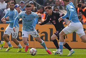 | Photo: AP/Seth Wenig : Inter Miami's Lionel Messi, second from right, moves the ball through New York City FC defenders during the first half of an MLS soccer game at Yankee Stadium in New York.