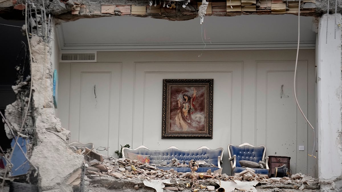Rubble covers the furniture of a destroyed living room in a residential building hit in an earlier U.S.-Israeli strike in Tehran, Iran, Monday, March 23, 2026. 
 - Photo: AP Photo/Vahid Salemi