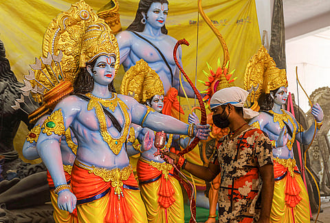 An artist gives final touches to a statue of Lord Ram ahead of Ram Navami festival, in Hyderabad.