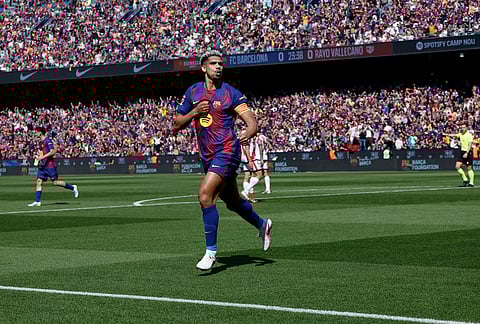 Barcelona's Ronald Araujo celebrates after scoring during a La Liga soccer match between Barcelona and Rayo Vallecano in Barcelona, Spain.