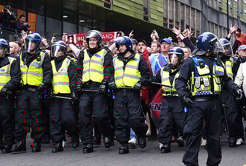 Police surround Sunderland fans ahead of the Premier League match between Newcastle and Sunderland outside St James' Park, Newcastle upon Tyne, England.