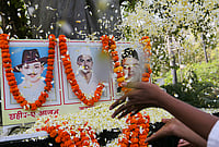 Day In Pics: March 23, 2026 | Photo: PTI : People pay floral tribute to freedom fighters Bhagat Singh, Sukhdev Thapar and Shivaram Rajguru on the 'Shaheed Diwas', or Martyrs' Day, in Prayagraj.