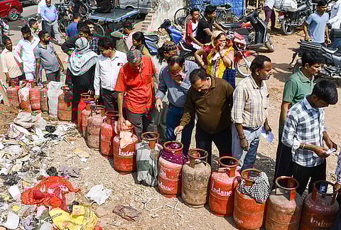 Consumers wait in a queue amid LPG supply disruptions in Prayagraj.
