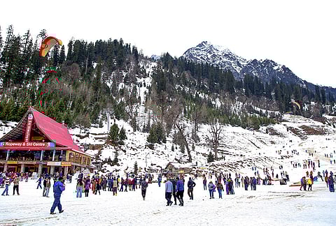 Tourists visit the Solang Valley after recent snowfall, near Manali, Himachal Pradesh.