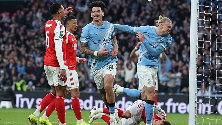 Manchester City's Nico O'Reilly celebrates after scoring the opening goal during the English League Cup final soccer match between Arsenal and Manchester City in London, Sunday, March 22, 2026. - AP Photo