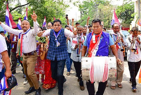 AGP supporters celebrate during a rally for Assam Assembly elections, in Guwahati.