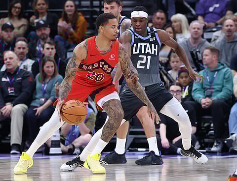 Toronto Raptors guard Markelle Fultz (20) dribbles against Utah Jazz guard Bez Mbeng (21) during the first half of an NBA basketball game in Salt Lake City.