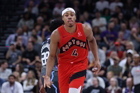 Toronto Raptors forward Scottie Barnes reacts after making a basket at the buzzer to end the first half of an NBA basketball game against the Utah Jazz in Salt Lake City.