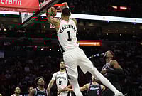 | Photo: AP/Lynne Sladky : San Antonio Spurs forward Victor Wembanyama (1) dunks over Miami Heat center Bam Adebayo, right, during the first half of an NBA basketball game in Miami. 