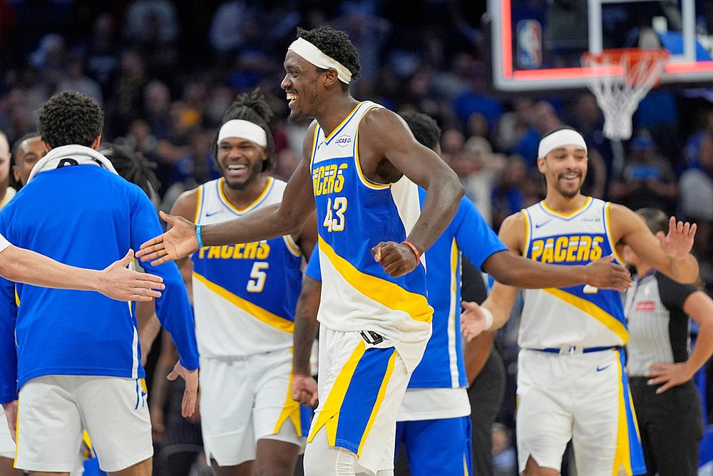 Indiana Pacers forward Pascal Siakam (43) celebrates with teammates including forward Jarace Walker (5) and guard Andrew Nembhard, right, after defeating the Orlando Magic in an NBA basketball game in Orlando, Fla. - | Photo: AP/John Raoux