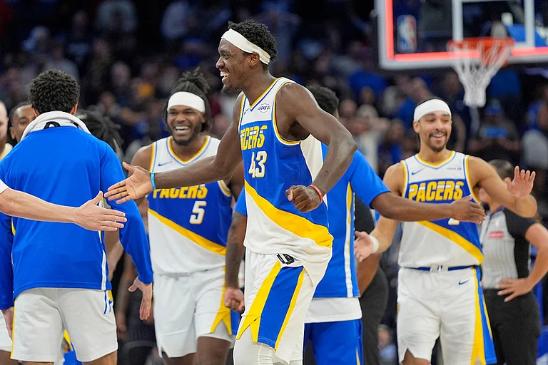 Indiana Pacers forward Pascal Siakam (43) celebrates with teammates including forward Jarace Walker (5) and guard Andrew Nembhard, right, after defeating the Orlando Magic in an NBA basketball game in Orlando, Fla. - | Photo: AP/John Raoux