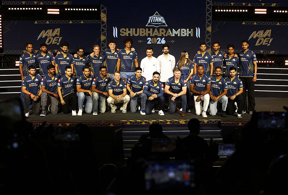 Gujarat Titans skipper Shubman Gill with team players, GT's directors Shaan Mehta and Jinal Mehta, former England player and GT’s director of cricket Vikram Solanki and others pose for a group photograph during the franchise's "Shubharambh 2026" event featuring the squad, owners and partners, in Ahmedabad. - | Photo: PTI 