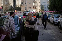 AP Photo/Ohad Zwigenberg :  People react at the site of an Iranian missile strike in Tel Aviv, Israel, Tuesday, March 24, 2026. 
