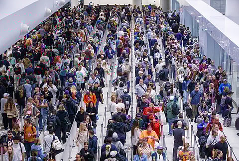 Travelers navigate their way through the TSA screening process lines at Louis Armstrong International Airport in Kenner, La. near New Orleans.