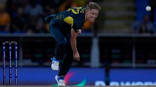 | Photo: AP/Ricardo Mazalan : Nathan Ellis bowls against Namibia