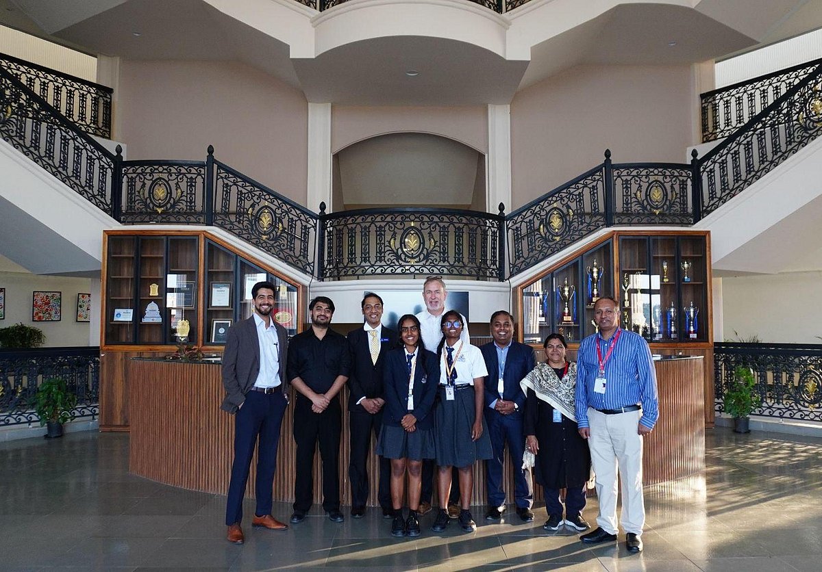Group photo in a grand school lobby