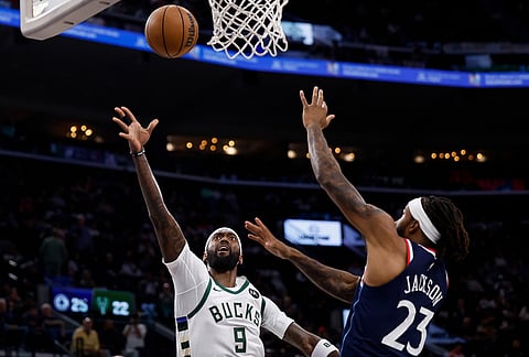 Milwaukee Bucks forward Bobby Portis (9) drives to the basket with the ball while being guarded by LA Clippers forward Isaiah Jackson (23) during the first half of an NBA basketball game in Inglewood, California.