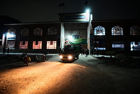 A vehicle loaded with donated goods departs at the conclusion of a relief drive for Iran in Budgam, Kashmir.