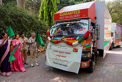 Chief Postmaster General K Prakash and others flag off a Mobile Theatre Van to create awareness about the efficiency, affordability and wide reach of 24-hour and 48-hour Speed Post services at the General Post Office, in Bengaluru.