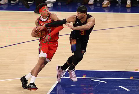 New Orleans Pelicans' Jeremiah Fears (0) drives to the basket against New York Knicks' Josh Hart (3) during the second half of an NBA basketball game in New York. 