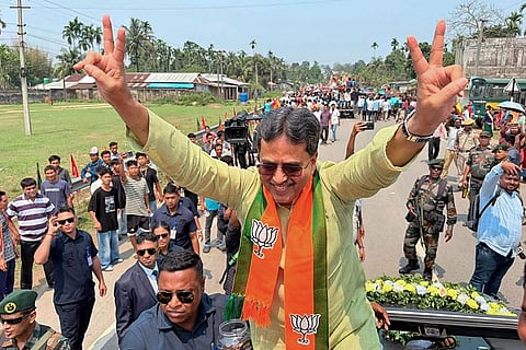 In this image posted on March 25, 2026, Tripura Chief Minister Manik Saha makes a victory sign as he campaigns for the BJP candidates nominated for the upcoming Tripura Tribal Areas Autonomous District Council (TTAADC) elections, in Dhalai district.