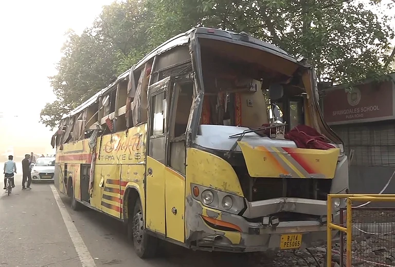 Damaged remains of a sleeper bus after it overturned near Hanuman Mandir, in Karol Bagh area, New Delhi. Two passengers were killed and 23 others injured in the incident. - | Photo: PTI