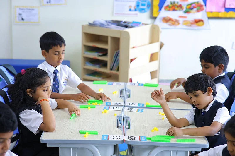 Students using math manipulatives in class