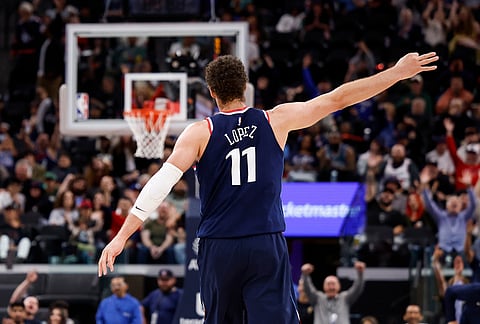 LA Clippers center Brook Lopez (11) reacts after scoring a three-pointer during the second half of an NBA basketball game against the Milwaukee Bucks, in Inglewood, California.