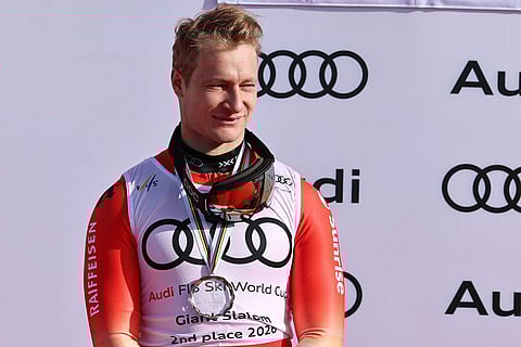Switzerland's Marco Odermatt wears the medal for second-ranked in the alpine ski, men's giant slalom discipline title, at the Lillehammer World Cup Finals, in Hafjell, Norway.