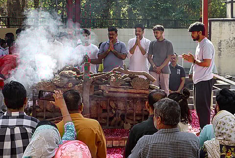 Family members of Harish Rana, the first person in India to be allowed passive euthanasia, perform rituals during his last rites, at Green Park Cremation Ground in New Delhi.