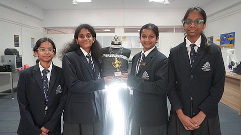 Manchester Global School students with trophy