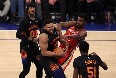 New Orleans Pelicans' Yves Missi (21) and New York Knicks' Karl-Anthony Towns (32) compete for the ball during the second half of an NBA basketball game in New York.