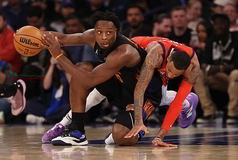New York Knicks OG Anunoby (8) defends the ball from New Orleans Pelicans Dejounte Murray (5) during the first half of an NBA basketball game in New York. 
