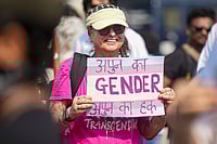 Photo: PTI/Shashank Parade : A member of the LGBTQIA+ community holds a placard during a protest against the passage of the Transgender Persons (Protection of Rights) Amendment Bill, 2026, in the Lok Sabha, at Azad Maidan, in Mumbai.