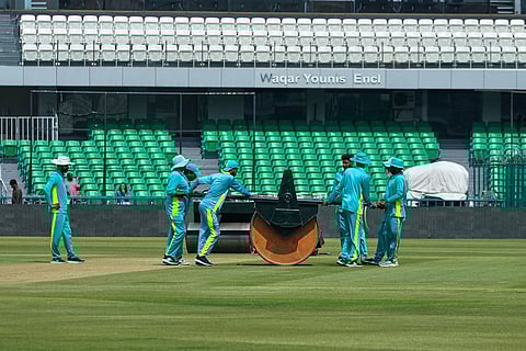 Groundsmen work at the at the Gaddafi Stadium in preparations for upcoming Pakistan's premier domestic T20 the Pakistan Super League, which will take place in empty stadiums due to the recent spike in oil prices, in Lahore, Pakistan.