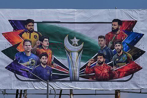 A billboard of Pakistan's premier domestic T20 the Pakistan Super League, which will take place in empty stadiums due to the recent spike in oil prices, is displayed at a road in Rawalpindi, Pakistan.