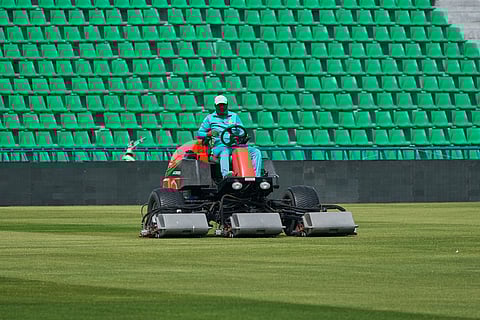 A groundsman works at the at the Gaddafi Stadium in preparations for upcoming Pakistan's premier domestic T20 the Pakistan Super League, which will take place in empty stadiums due to the recent spike in oil prices, in Lahore, Pakistan.