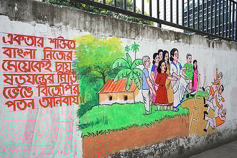 A wall graffiti shows TMC's campaign for the upcoming West Bengal Assembly elections, in Kolkata.