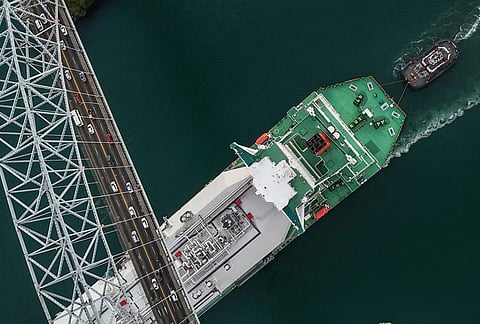 A liquefied natural gas carrier sails under Las Americas Bridge through the Panama Canal in Panama City.